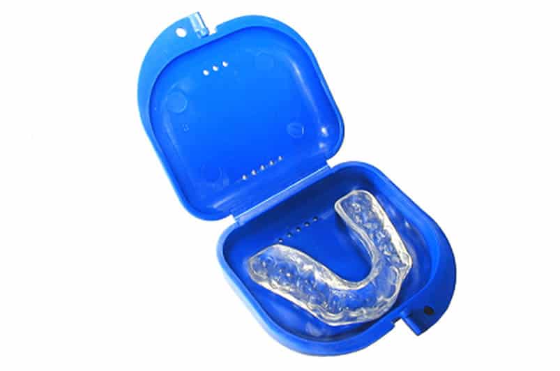 clear plastic mouth guard in blue case