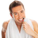Man brushing teeth isolated on white